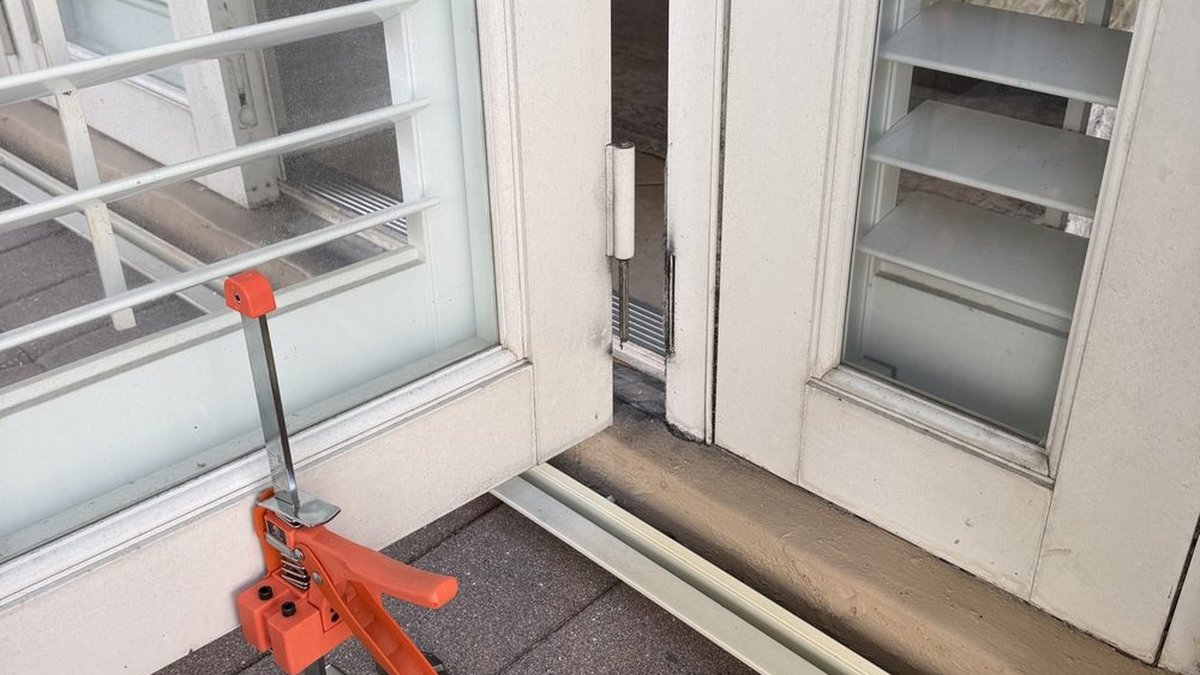 French patio door hardware being repaired